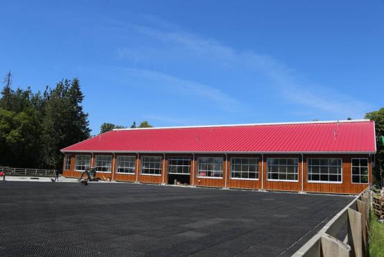 covered horse arena with elevated seating