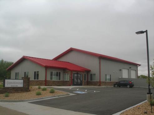 office and shop combination commercial building with red metal roof
