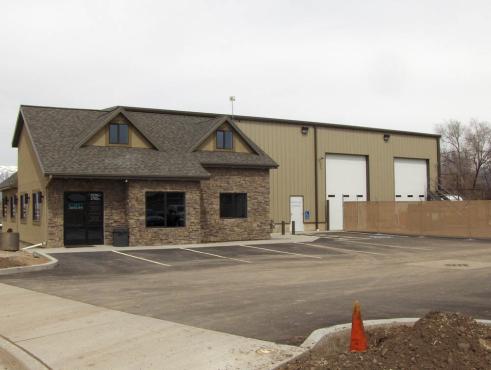 steel commercial building with stone wall feature