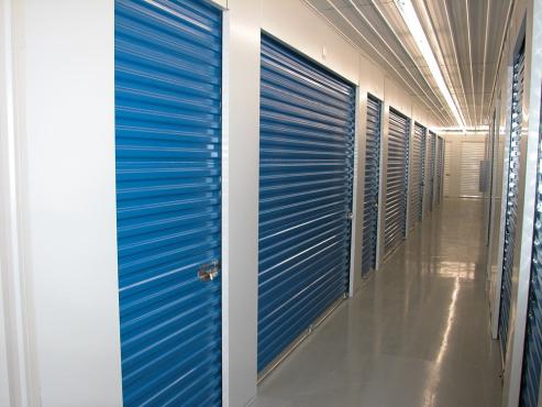 self storage building inside view with blue doors